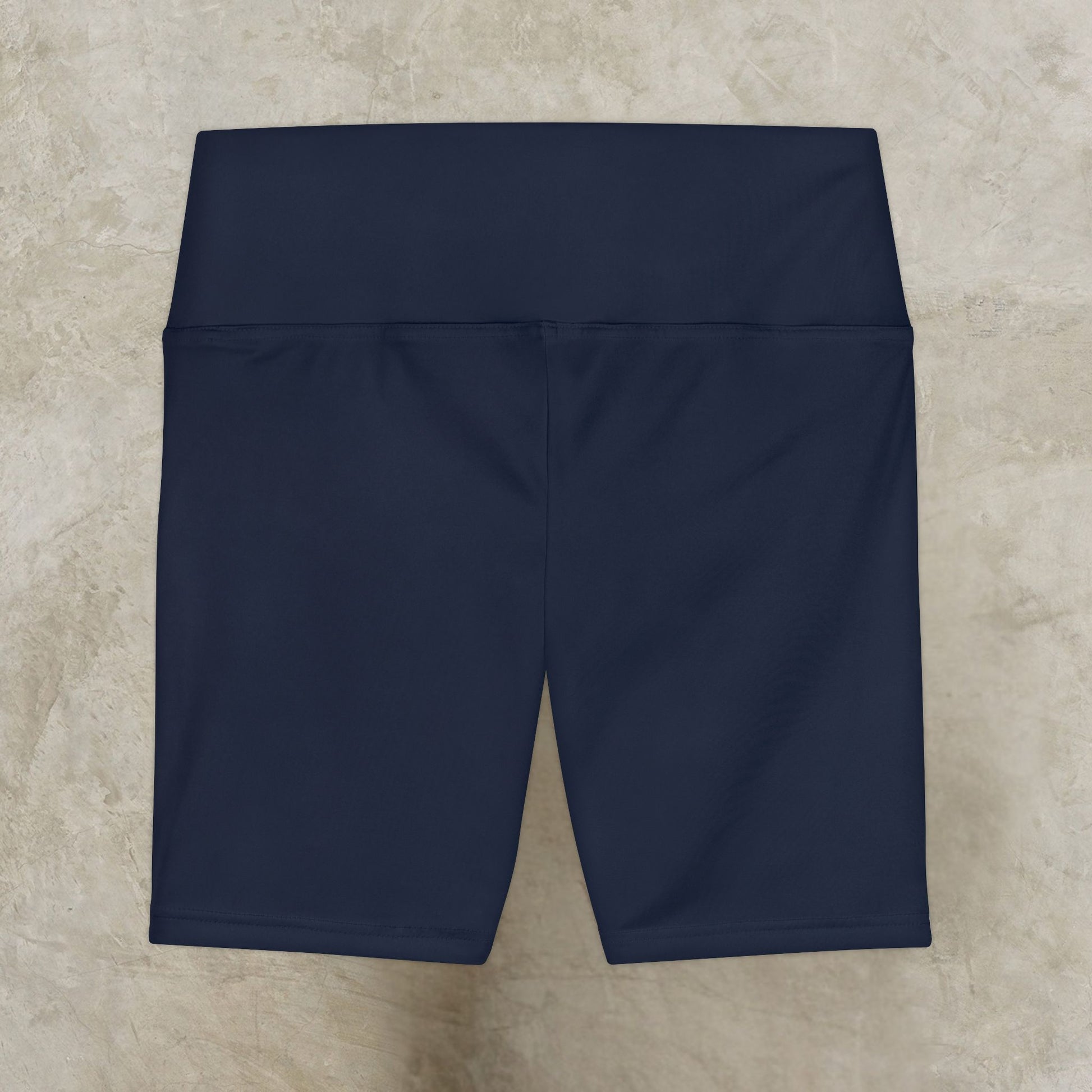 Navy blue shorts on a beige tiled floor