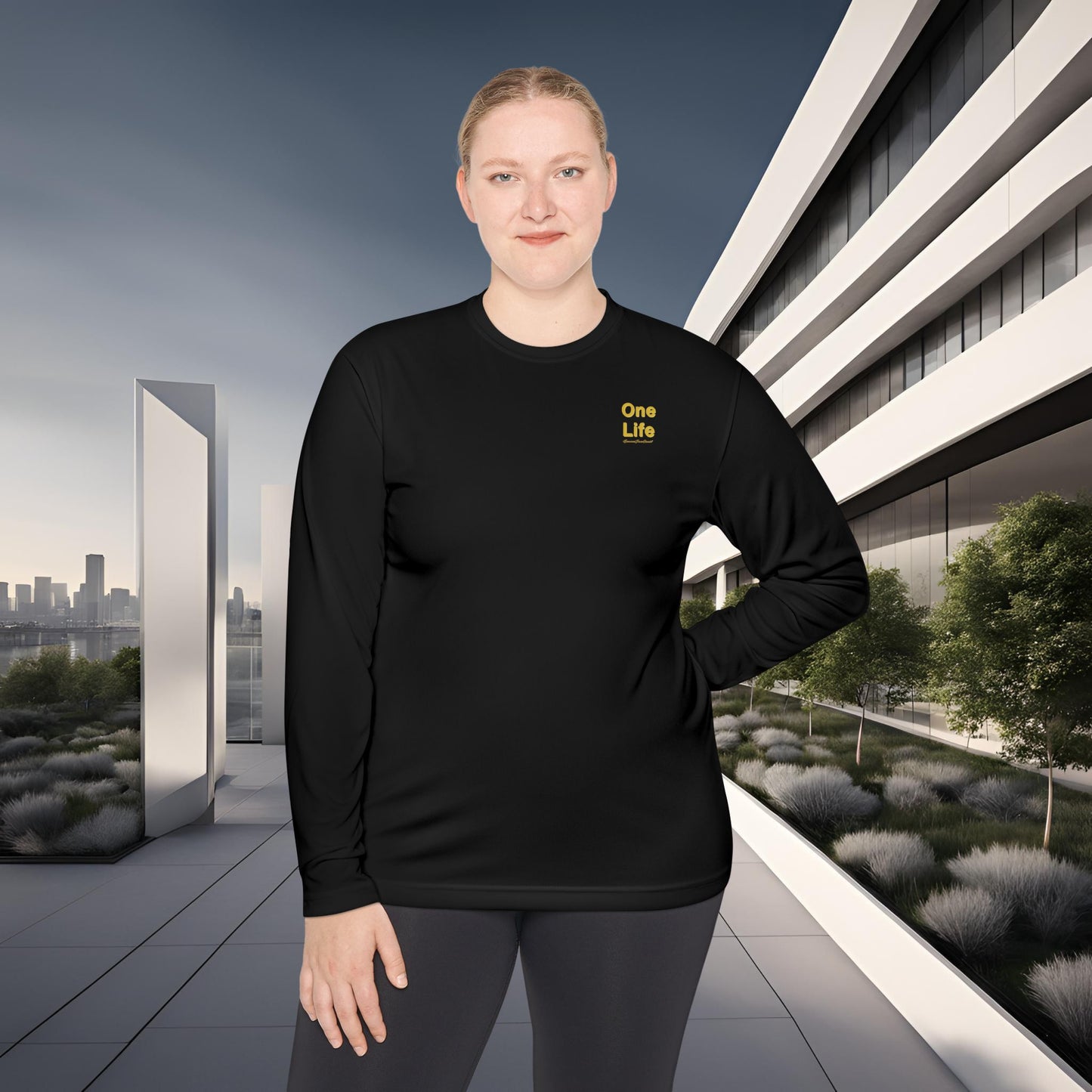 Person wearing a black long-sleeve shirt with a One Life logo in an urban setting
