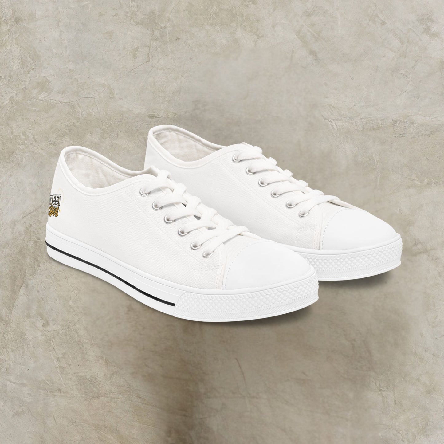 Pair of white Essence Innovation 'Street Vibes' sneakers on a gray concrete surface