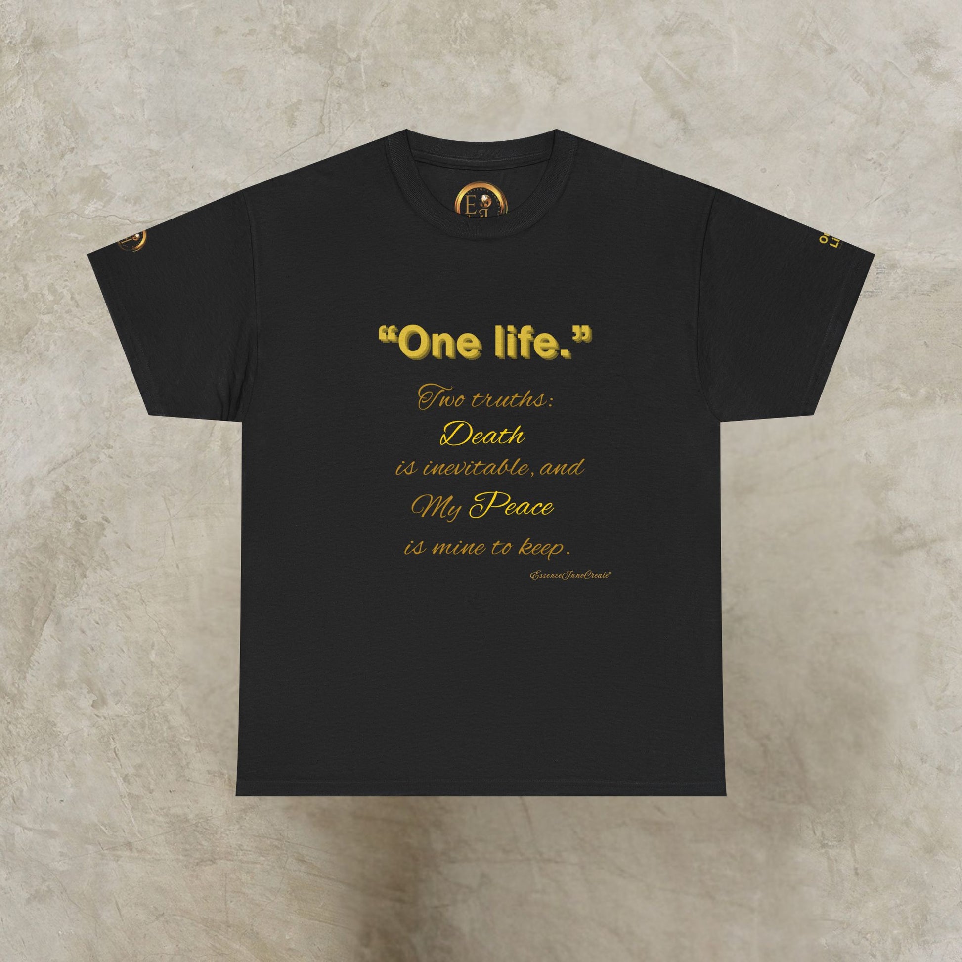 Black t-shirt with gold One Life text on a textured beige background