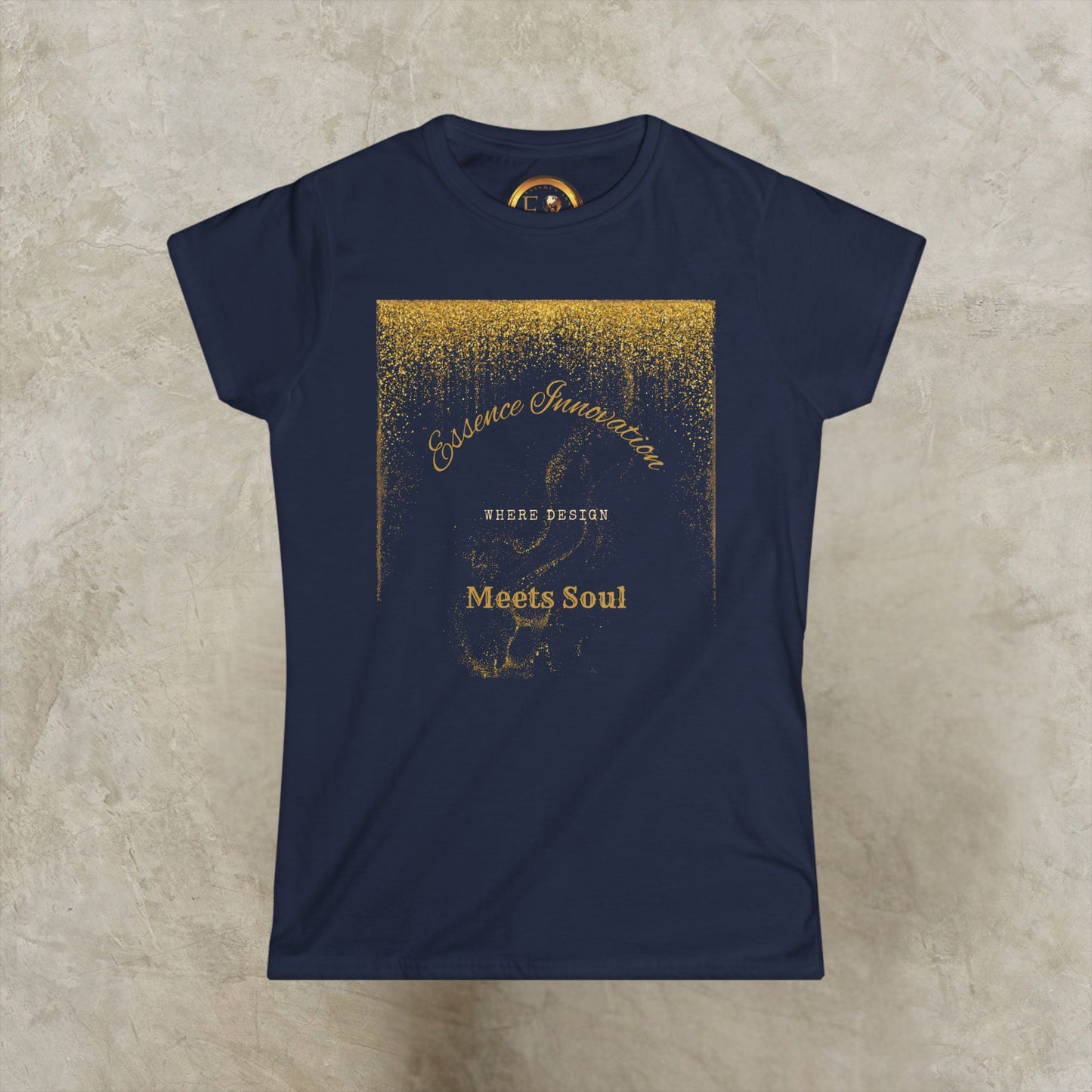 Navy blue t-shirt with gold graphic Essence Innovation 'Design Meets Soul' design on a beige background