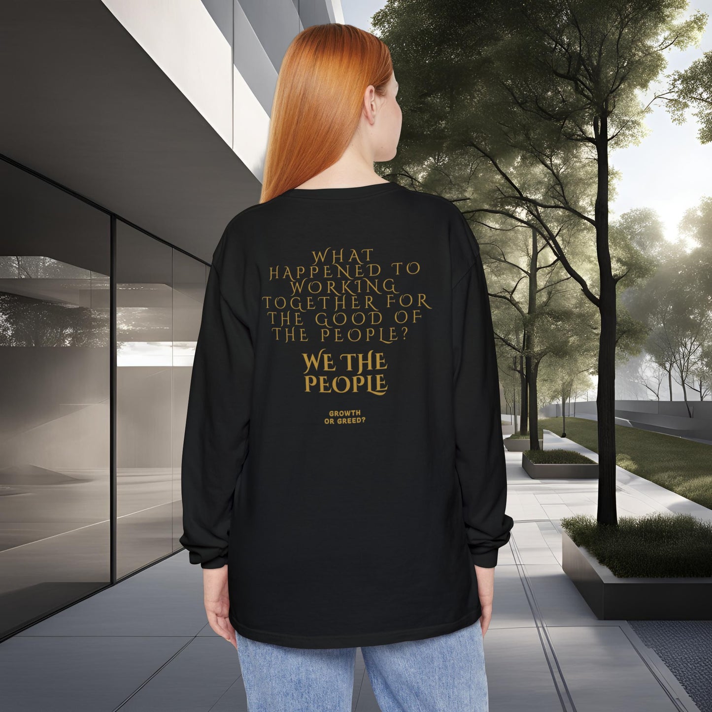 Person wearing a black long-sleeve EssenceInnoCreate Quiet Resolve shirt with text in an urban setting