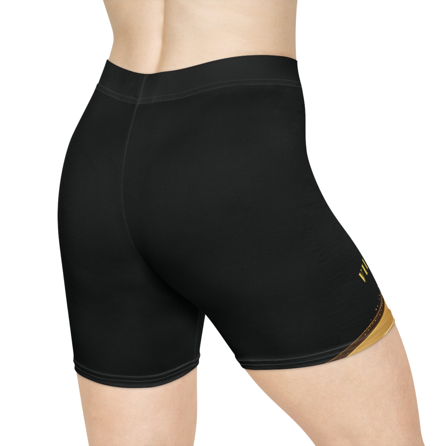 Black athletic shorts with a gold logo on a white background