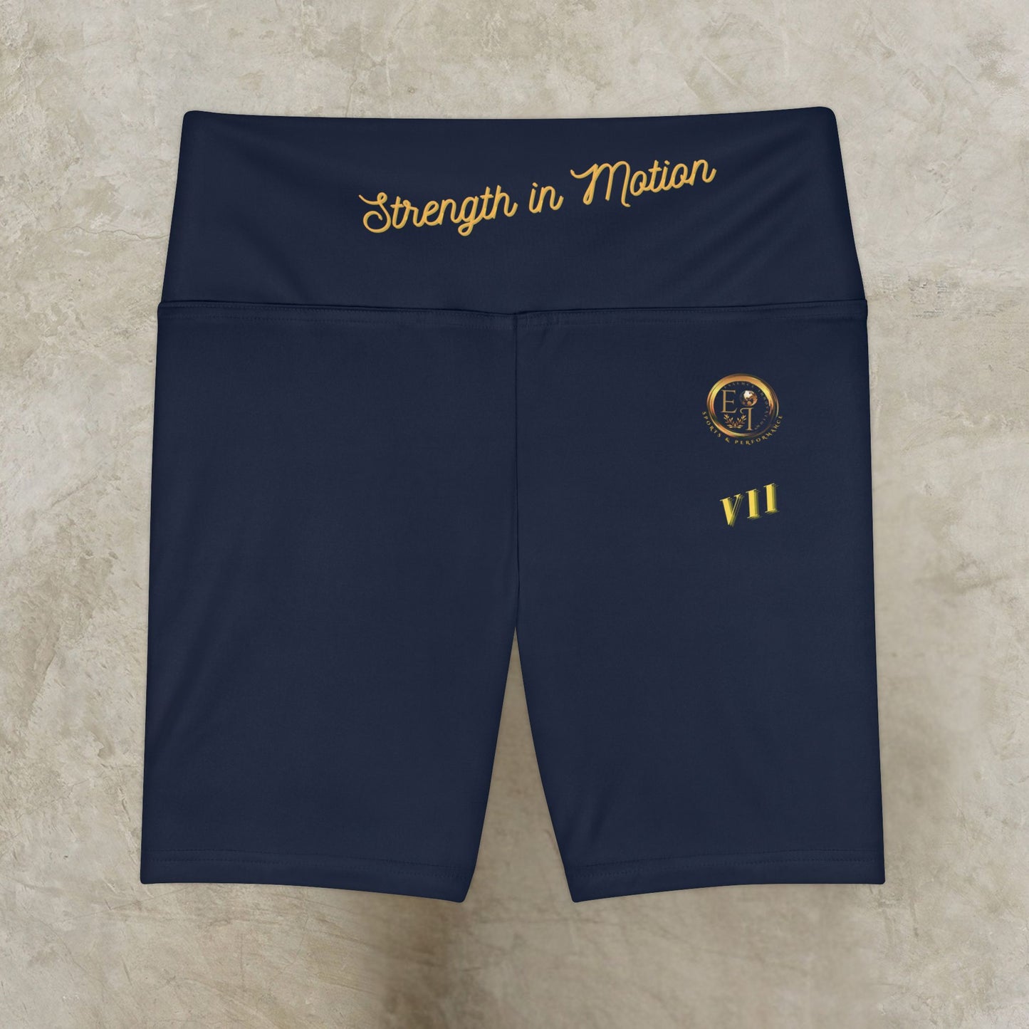 Navy blue shorts with gold text and logo on a beige surface