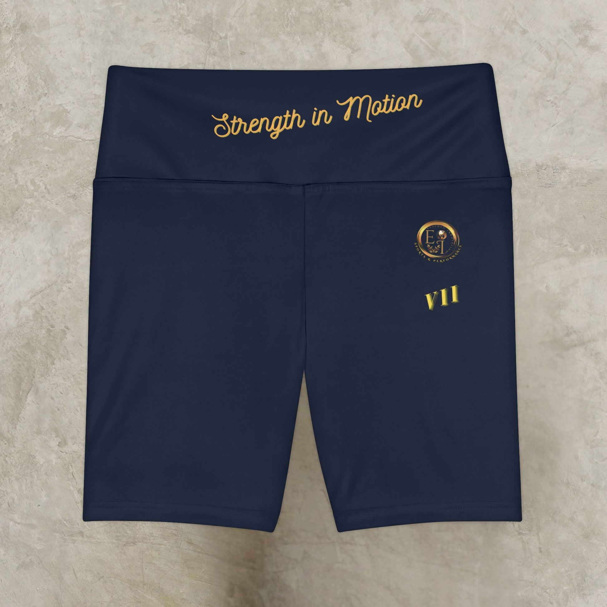 Navy blue shorts with gold text and logo on a beige surface