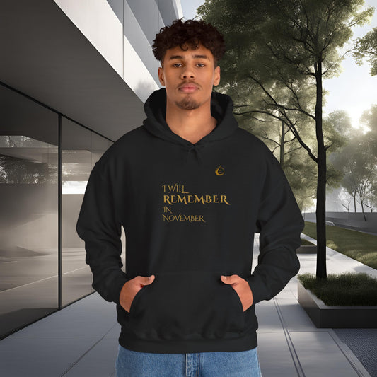 Person wearing a black EssenceInnoCreate Quiet Resolve hoodie with text standing in an outdoor setting