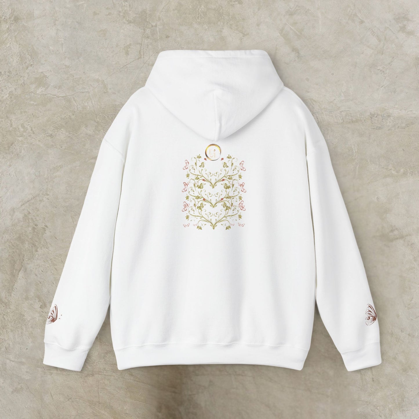White hoodie with Essence Innovation Bohemian Butterfly Crest text on the back against a beige background