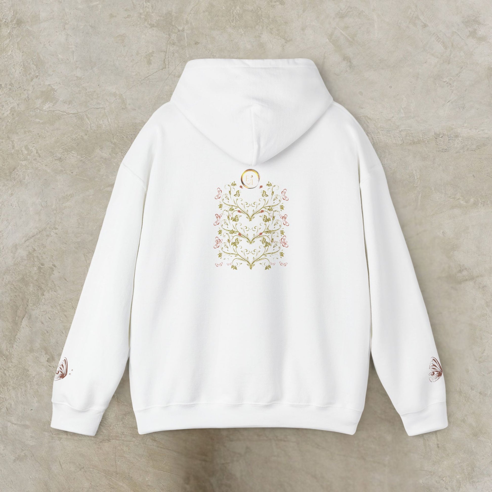 White hoodie with Essence Innovation Bohemian Butterfly Crest text on the back against a beige background