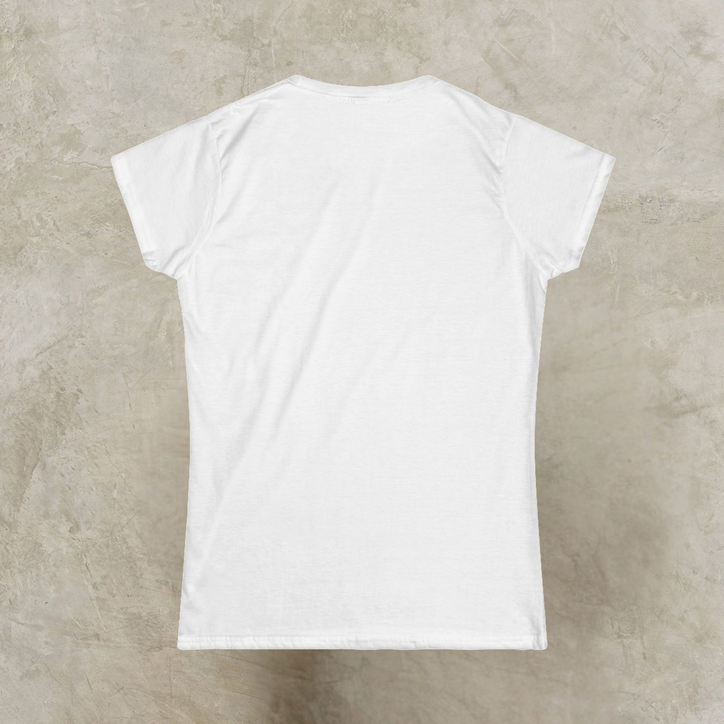White t-shirt on a textured beige surface
