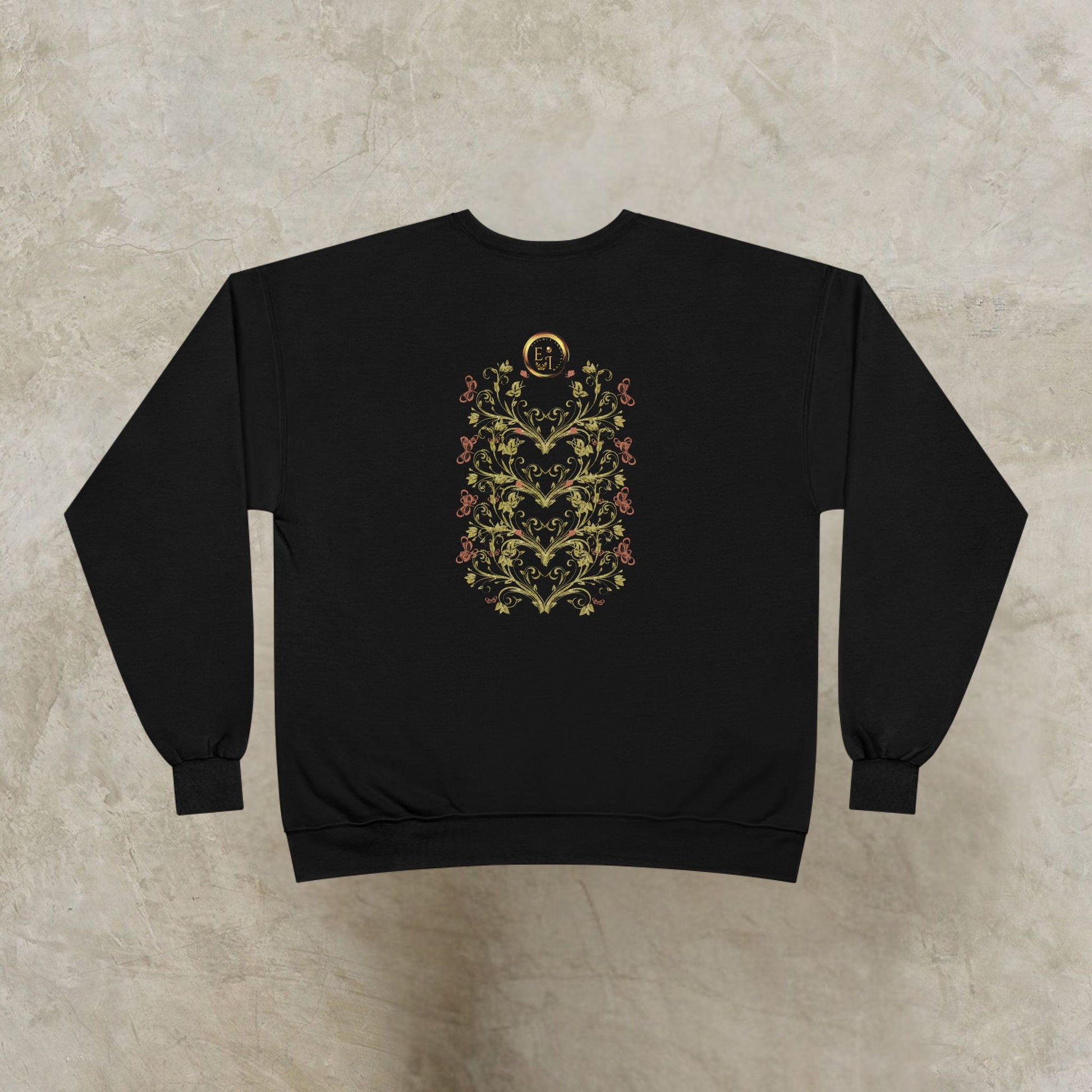 Black sweatshirt with floral Essence Innovation Bohemian Butterfly Crest design on a beige background