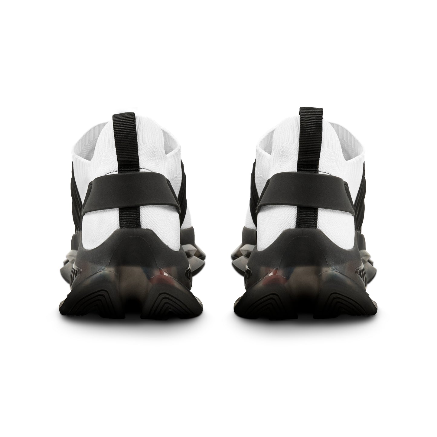 Black and white 'EssenceInnoCreate' athletic shoes with a unique sole design on a white background