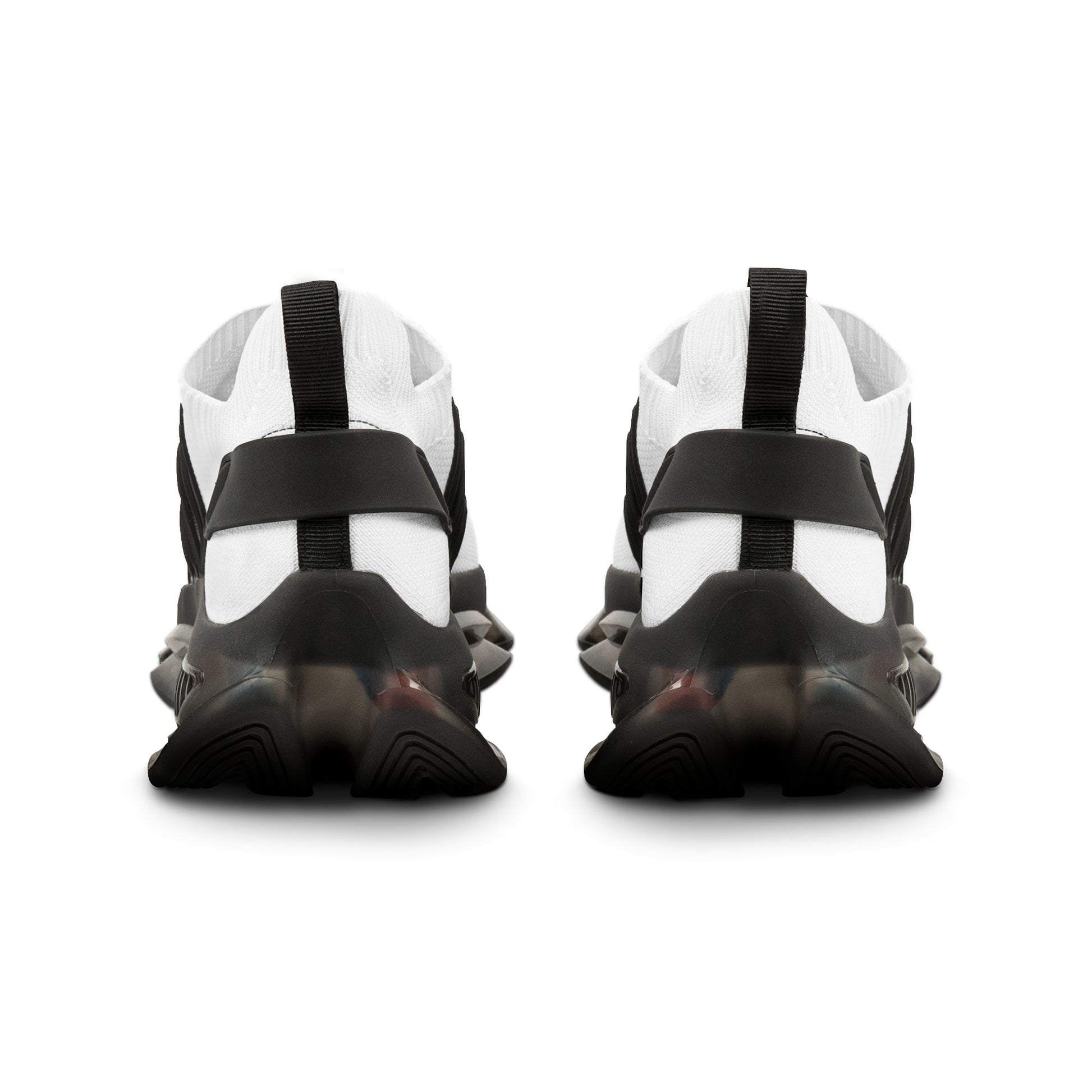 Black and white 'EssenceInnoCreate' athletic shoes with a unique sole design on a white background