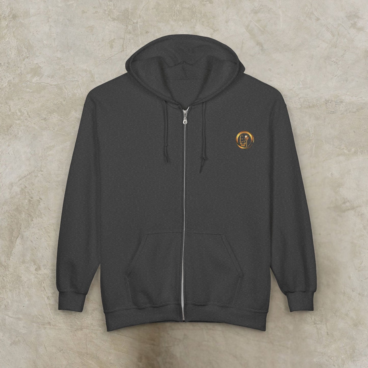 Dark gray Essence Innovation 'One Life' hoodie with a small logo on the chest against a beige background
