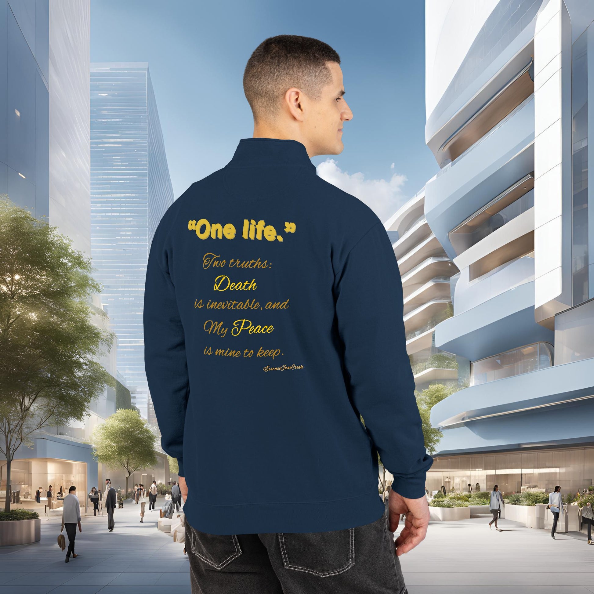 Man wearing a navy blue jacket with One Life text in an urban setting