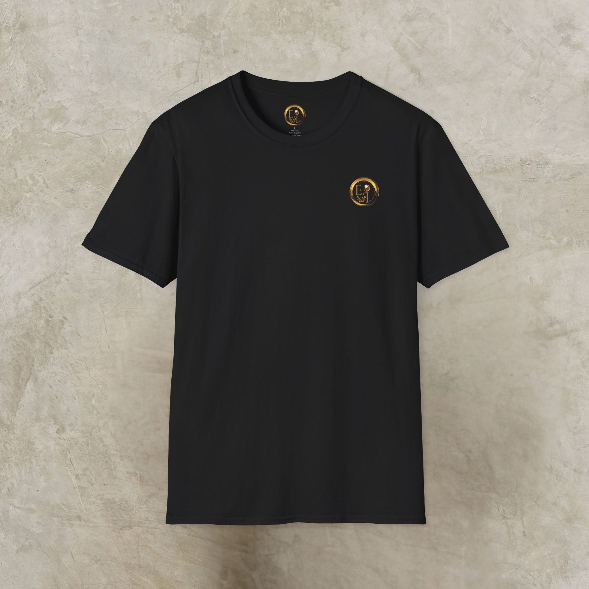 Black t-shirt with a gold Essence Innovation logo on a beige textured background