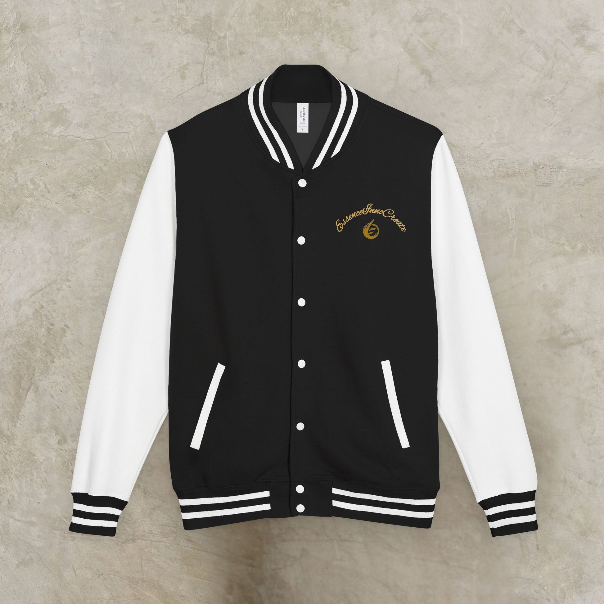 Black and white varsity jacket with a EssenceInnoCreate logo on a gray background