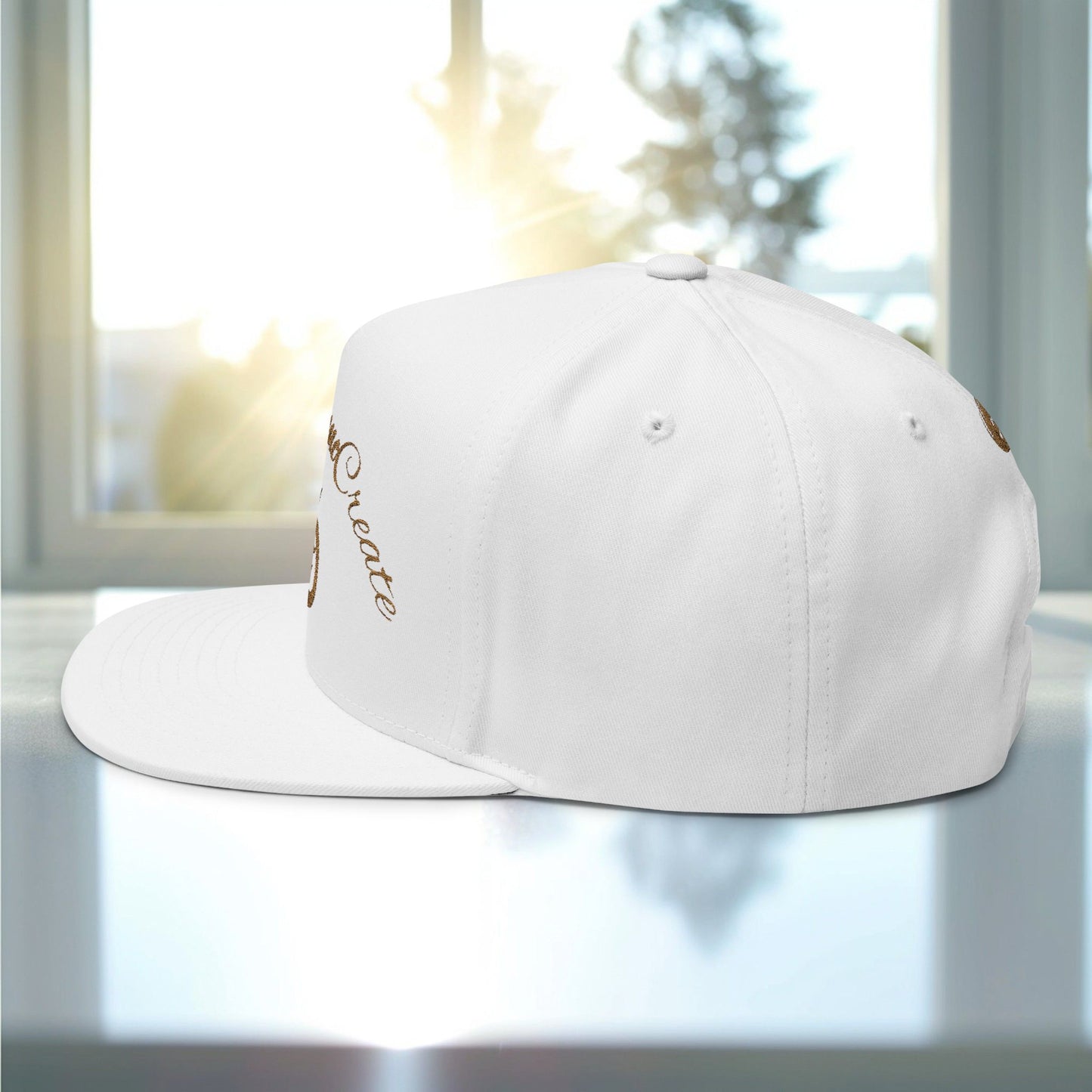 White cap with 'EssenceInnoCreate' embroidery on a reflective surface with a blurred indoor background
