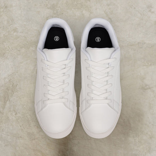 Pair of white EssenceInnoCreate sneakers on a light gray surface