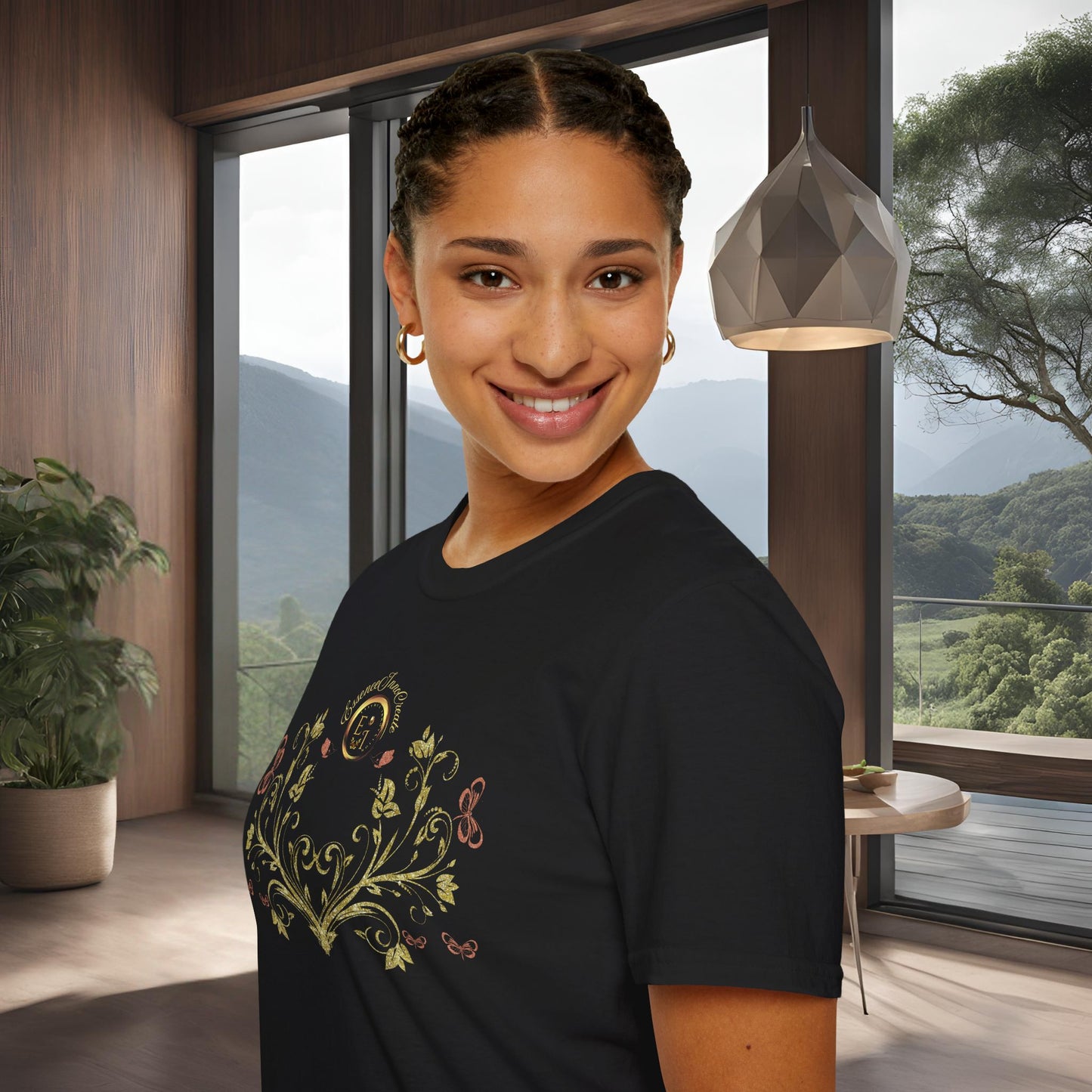 Woman wearing a black t-shirt with a colorful Essence Innovation Bohemian Butterfly design in a modern room with large windows.