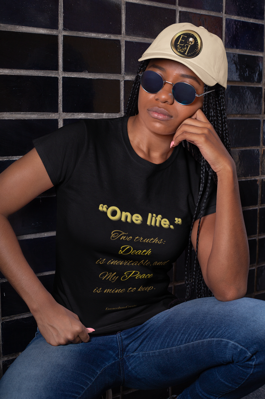 Black t-shirt with decorative One Life design on a beige background