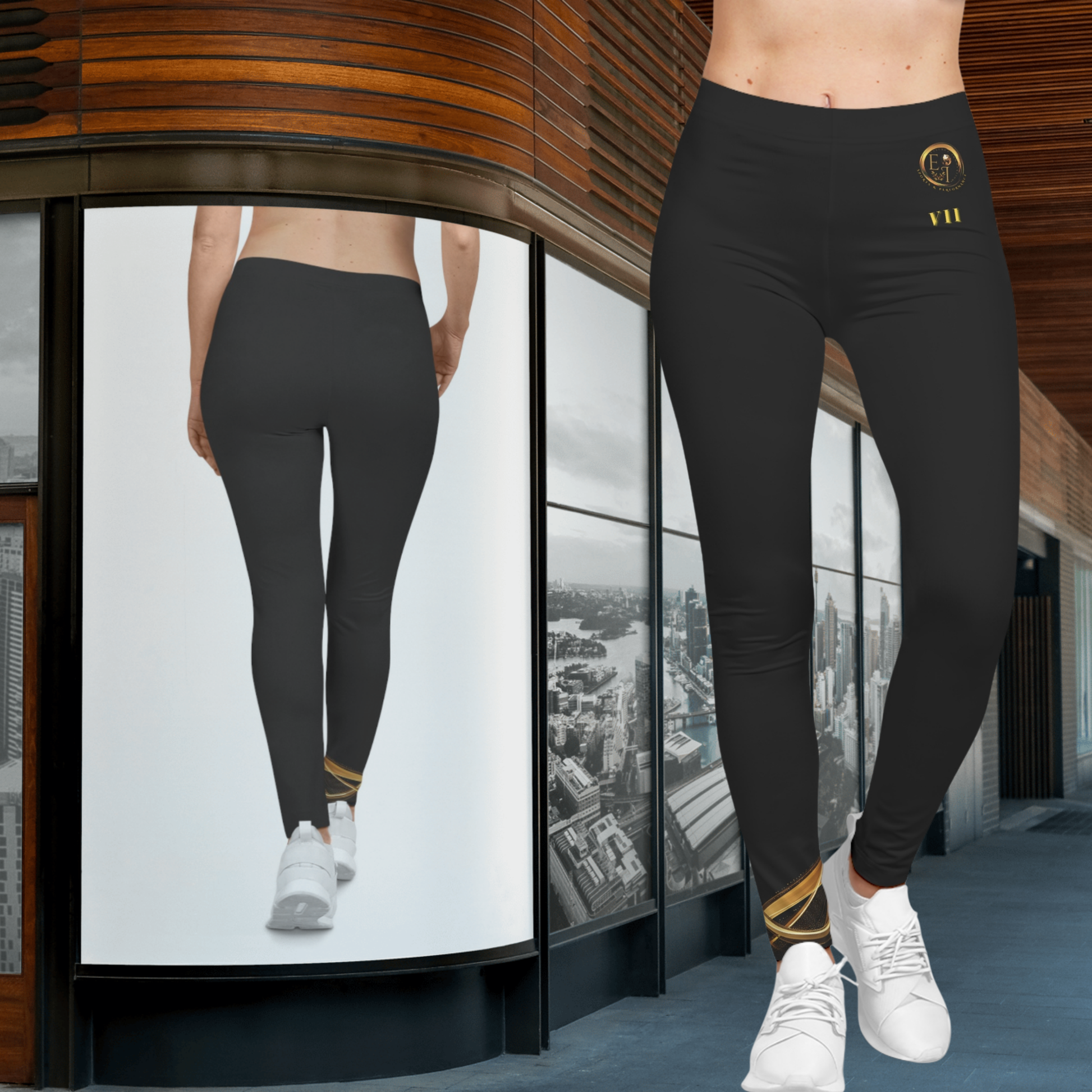 Person wearing black Essence Innovation leggings with a logo, standing in front of a glass wall with cityscape view.