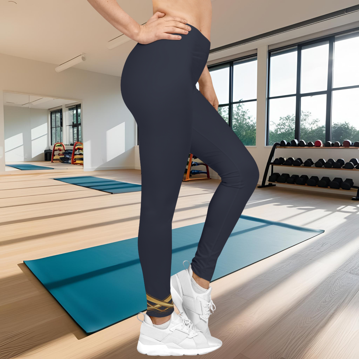 Person wearing navy Essence Innovation leggings and white sneakers in a gym setting
