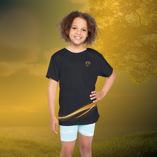 Child wearing a black Essence Innovation t-shirt with a gold design on a golden sunset background