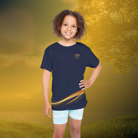 Child wearing a navy blue essence Innovation t-shirt with a gold stripe and light blue shorts on a white background