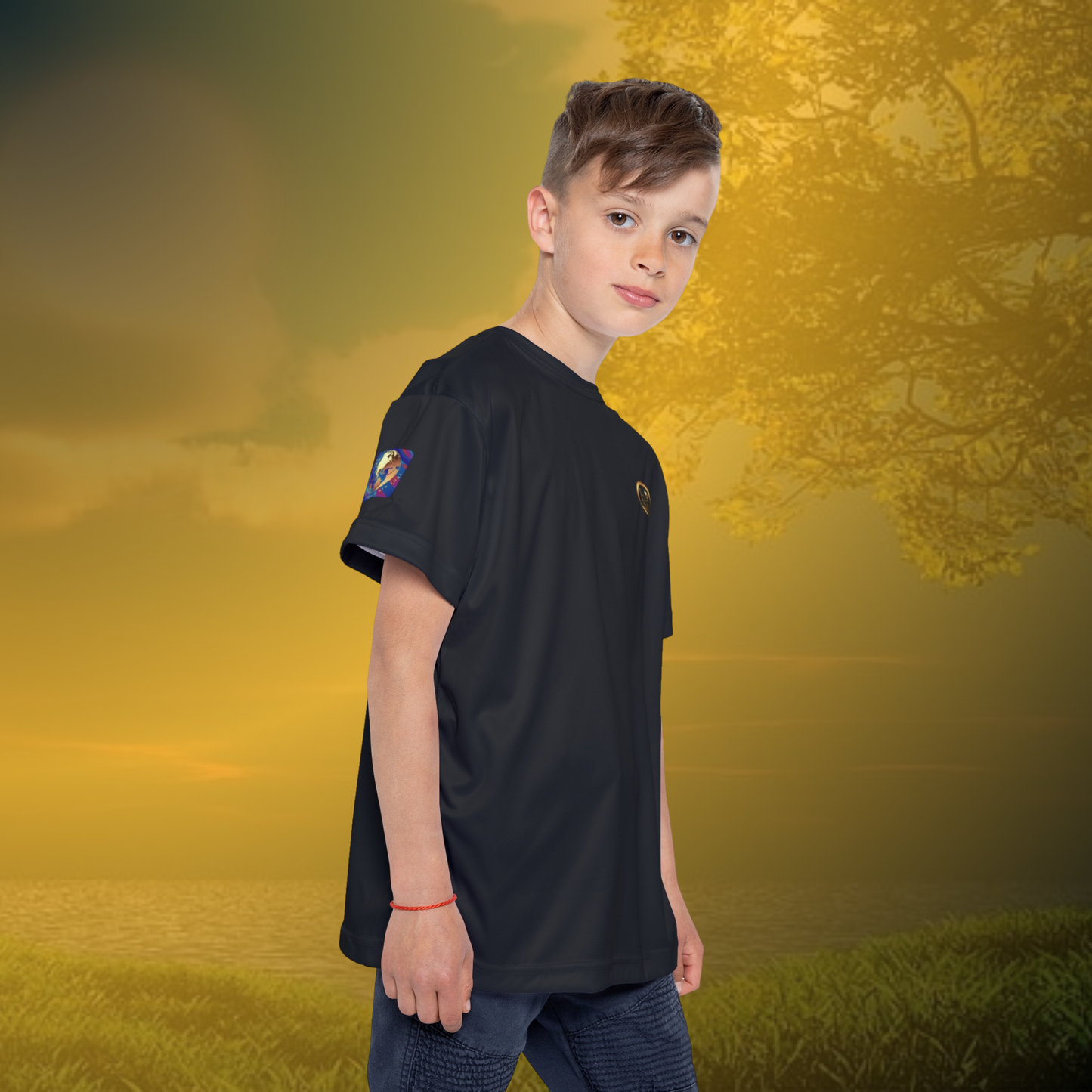 Child wearing a black Essence Innovation t-shirt with a logo on a golden sunset background