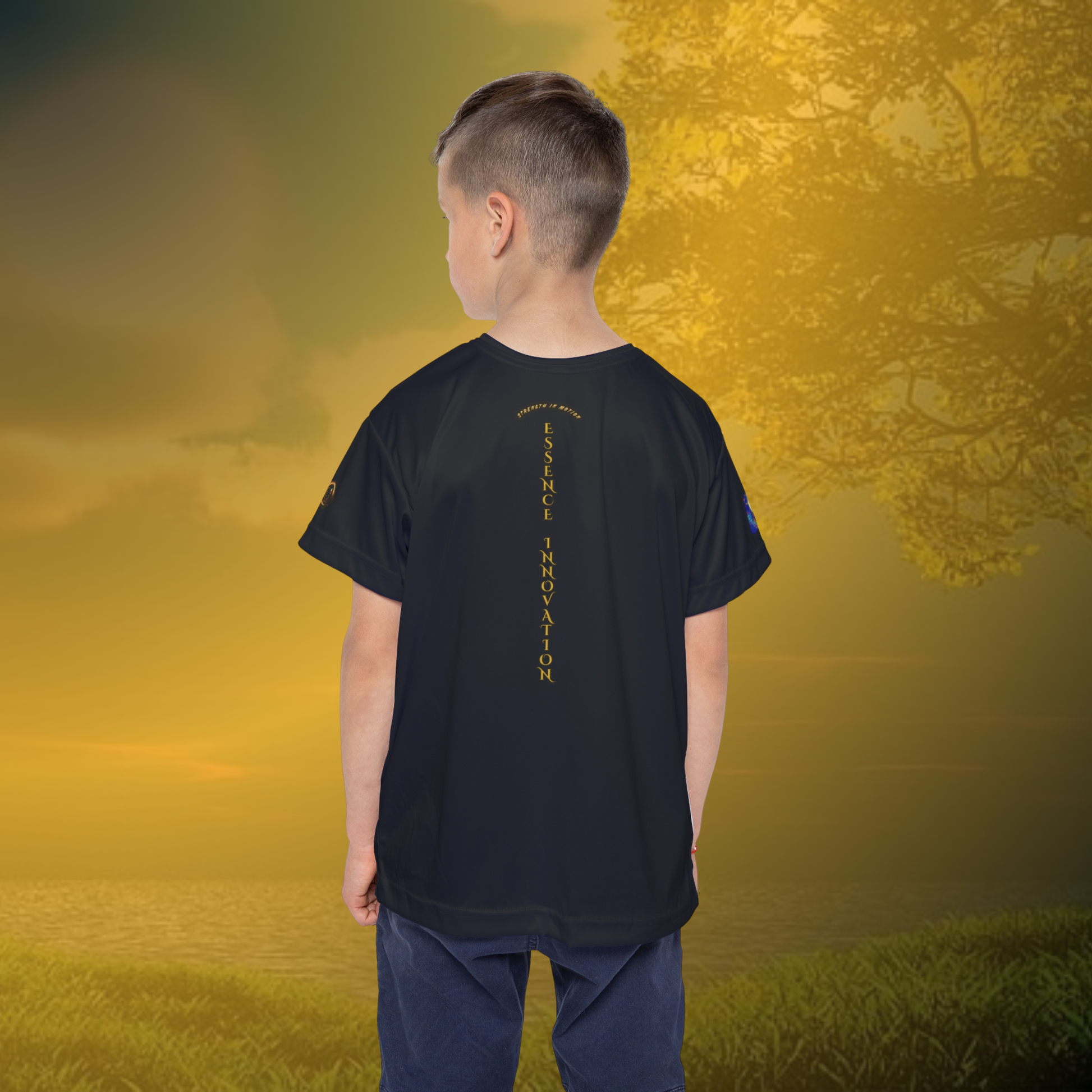 Child wearing a black Essence Innovation t-shirt with a logo on a golden sunset background