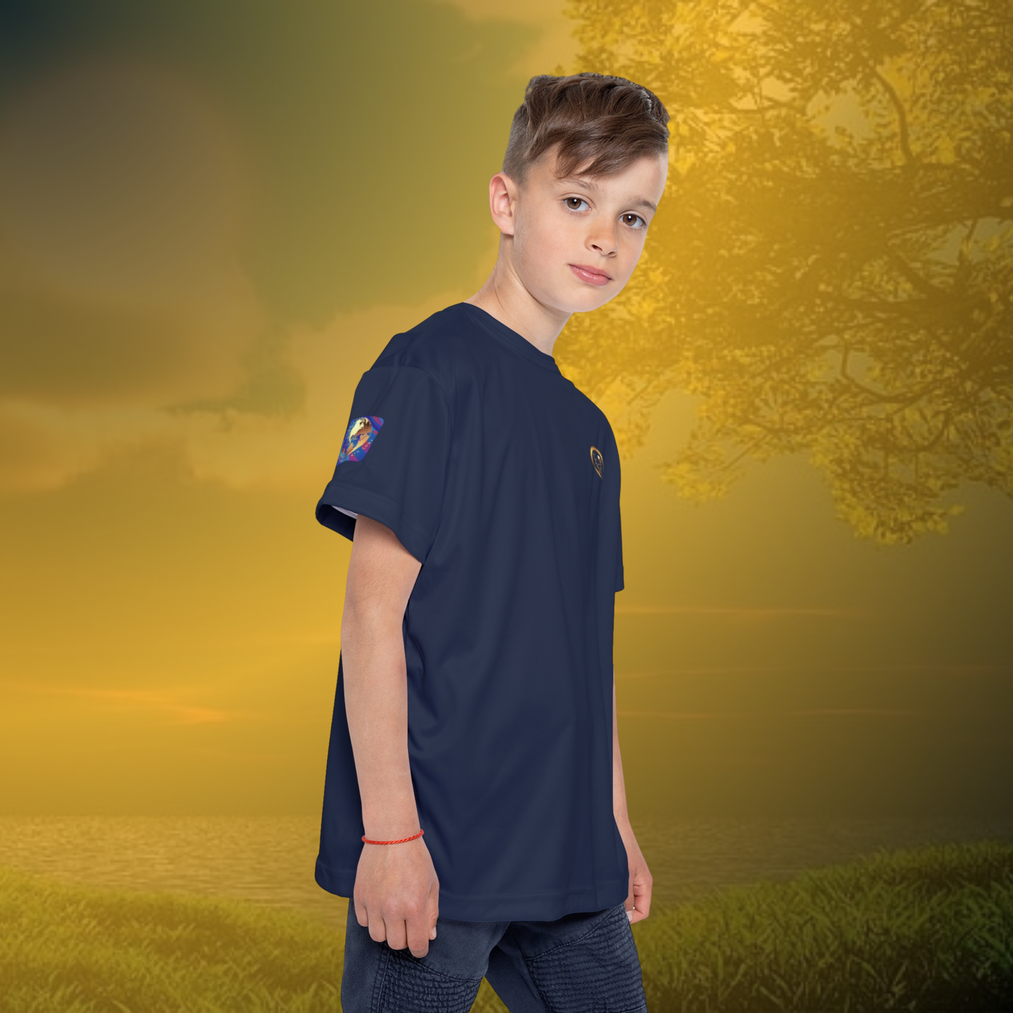 Child wearing a navy Essence Innovation t-shirt with a logo on a golden sunset background