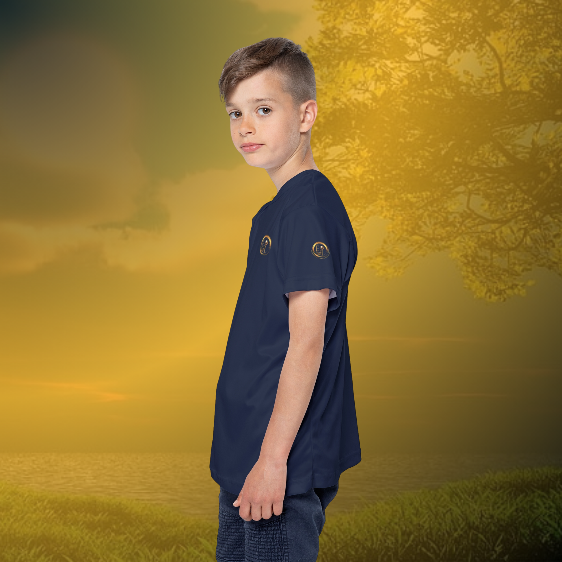 Child wearing a navy Essence Innovation t-shirt with a logo on a golden sunset background
