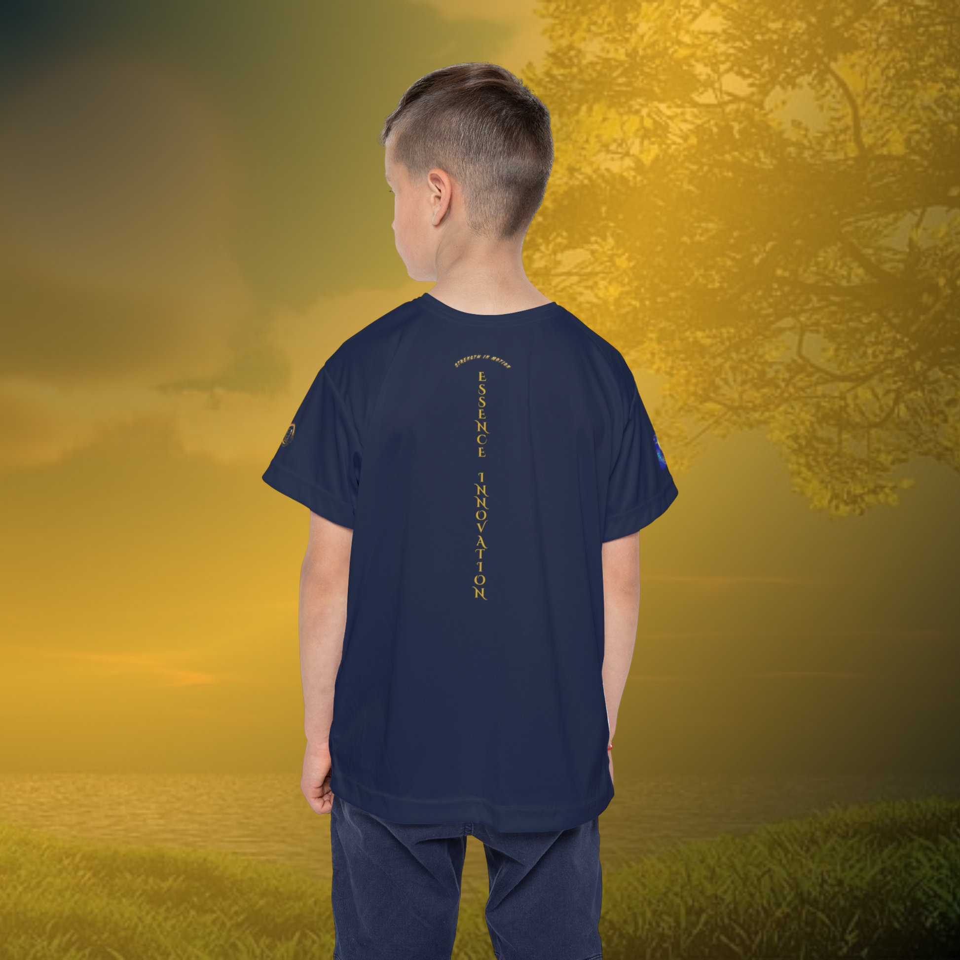 Child wearing a navy Essence Innovation t-shirt with a logo on a golden sunset background