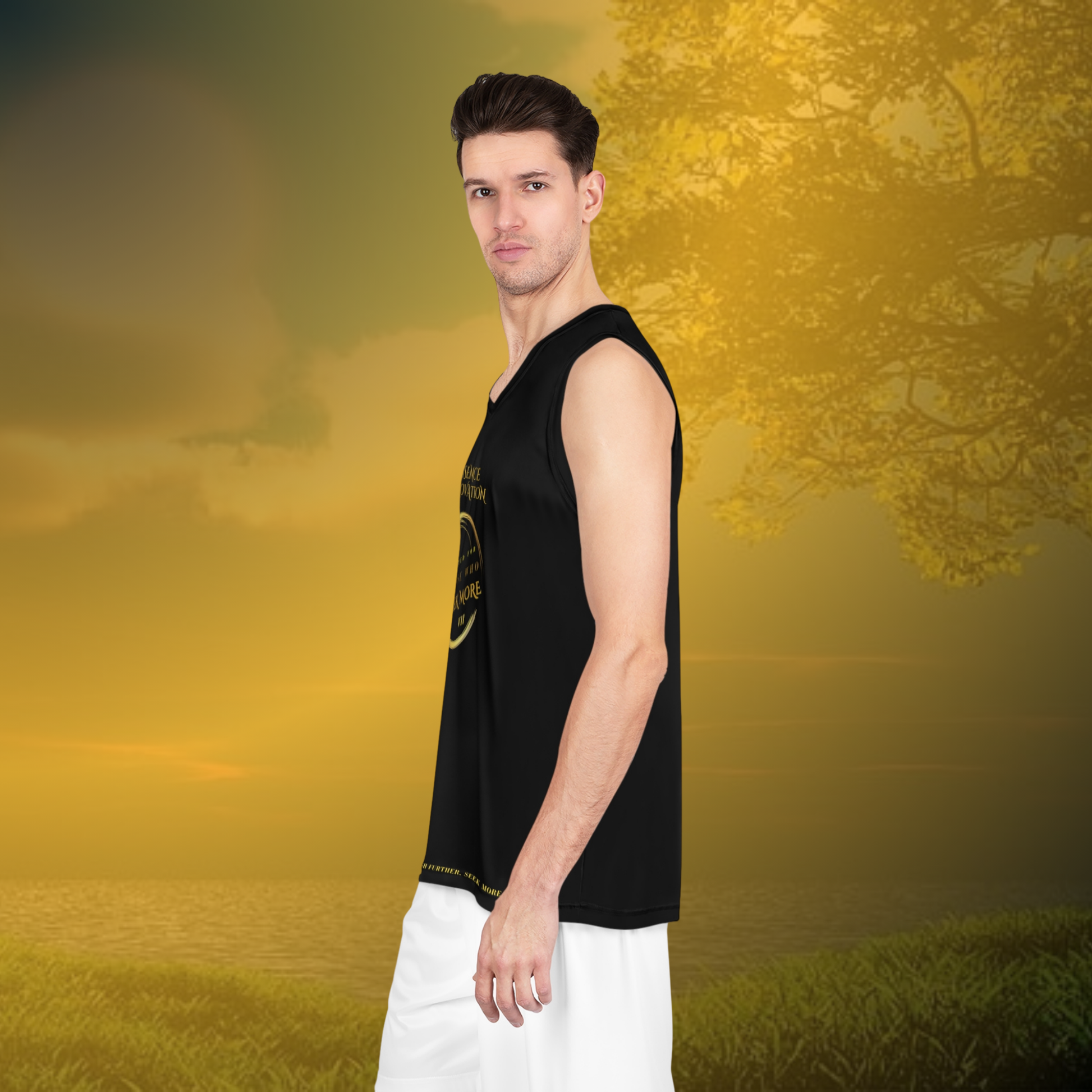 Man wearing a black sleeveless shirt and white pants standing in a field with a blurred natural background