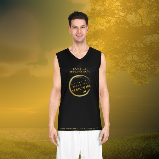 Man wearing a black sleeveless shirt with gold text against a scenic background