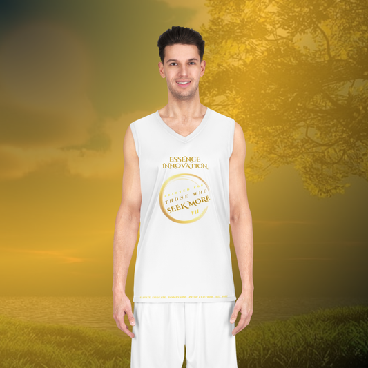 Man wearing a white sleeveless shirt with a logo and text, standing in a scenic outdoor setting.