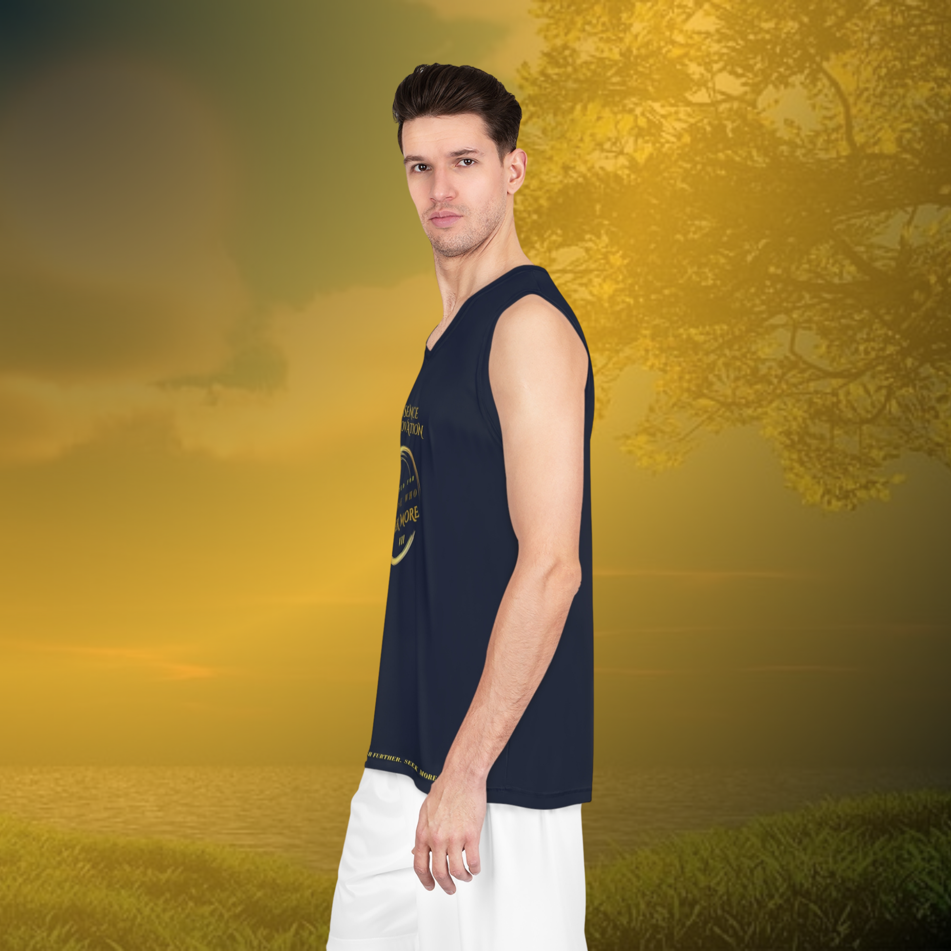 Man wearing a navy tank top and white pants standing in a field with a blurred background