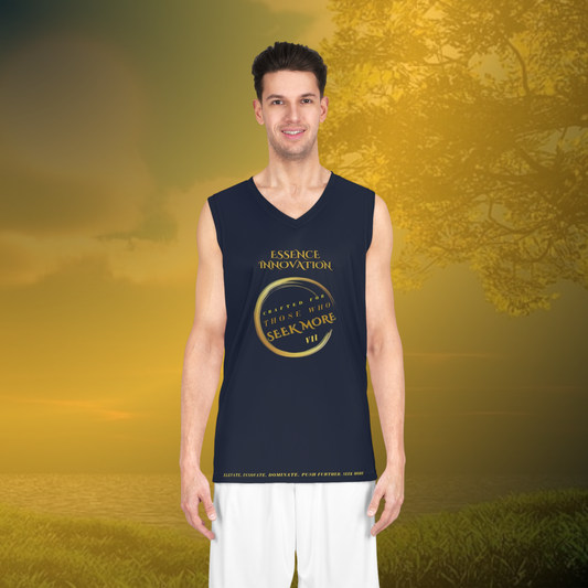 Man wearing a navy sleeveless shirt with gold text and design, standing outdoors with a blurred natural background.