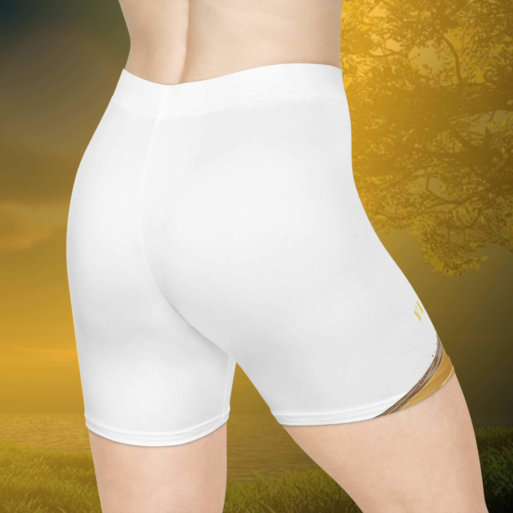 White Essence Innovation athletic shorts worn by a person with a blurred natural background