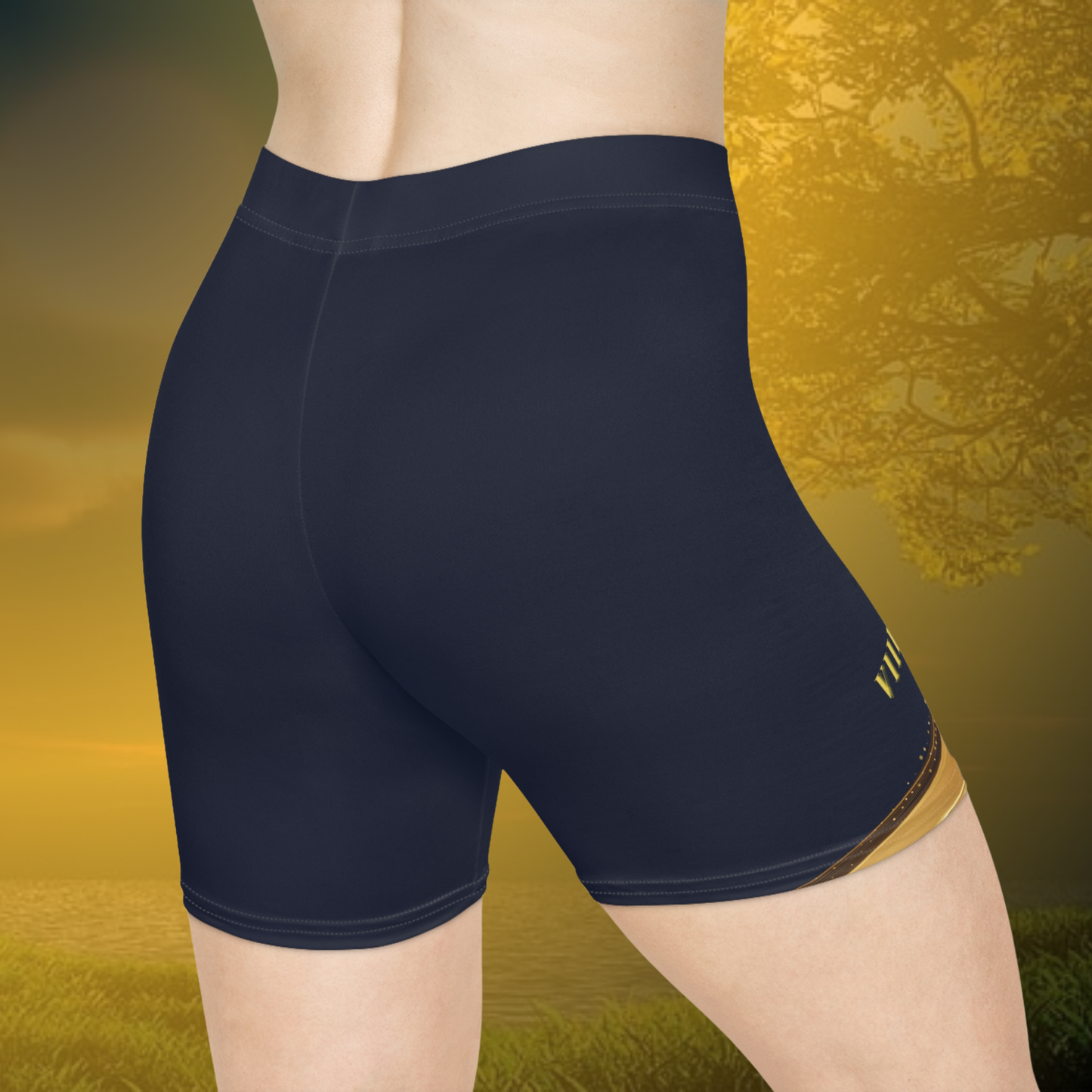 Essence Innovation Navy blue athletic shorts with a brand logo on a blurred natural background