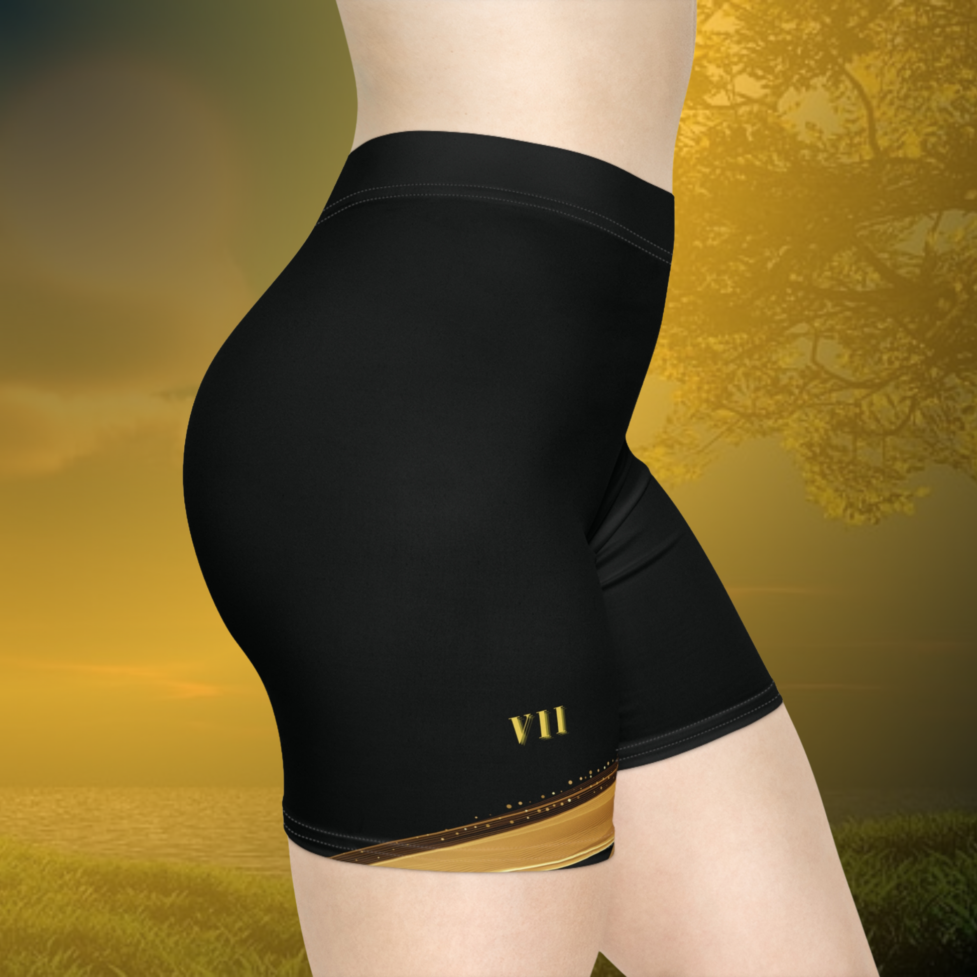 Black Essence Innovation athletic shorts with gold accents on a yellow background
