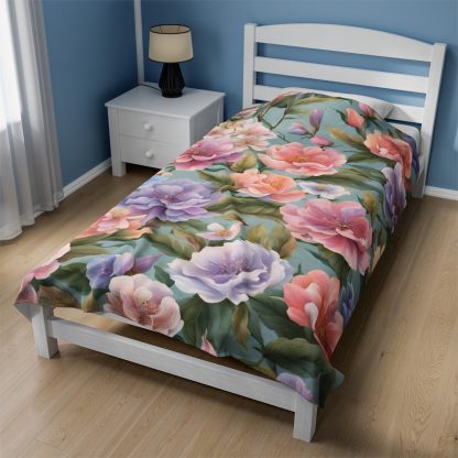 Floral Haven Plush Blanket with a colorful flower garden design, soft velveteen fabric, available in three sizes.